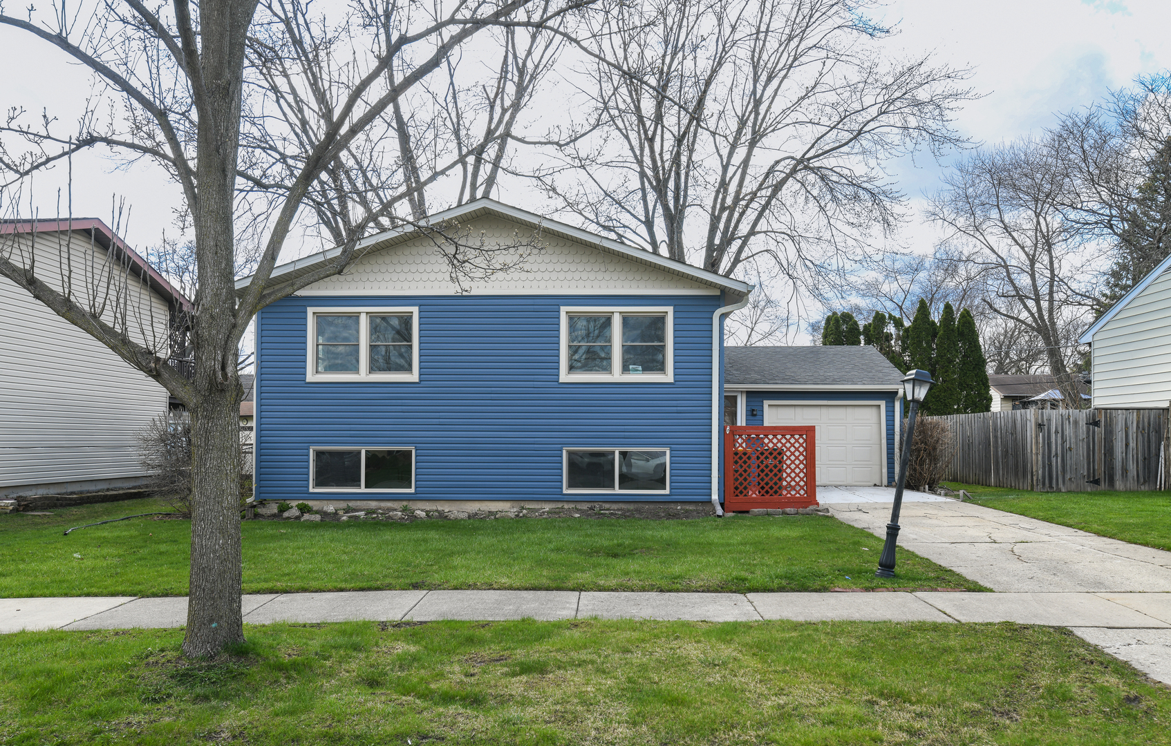 44 Redwood Trail Wheeling, IL 60090 - Photo 2 of 18 a front view of a house with a garden and yard