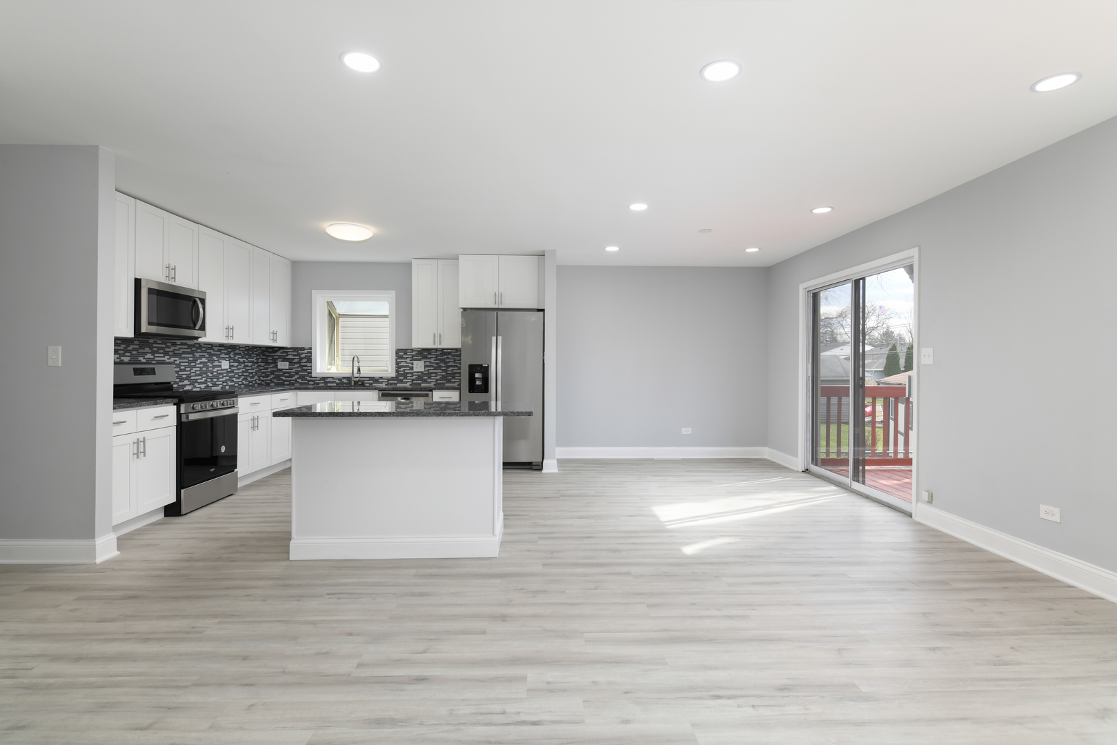 44 Redwood Trail Wheeling, IL 60090 - Photo 5 of 18 a view of kitchen with granite countertop stainless steel appliances refrigerator sink and cabinets