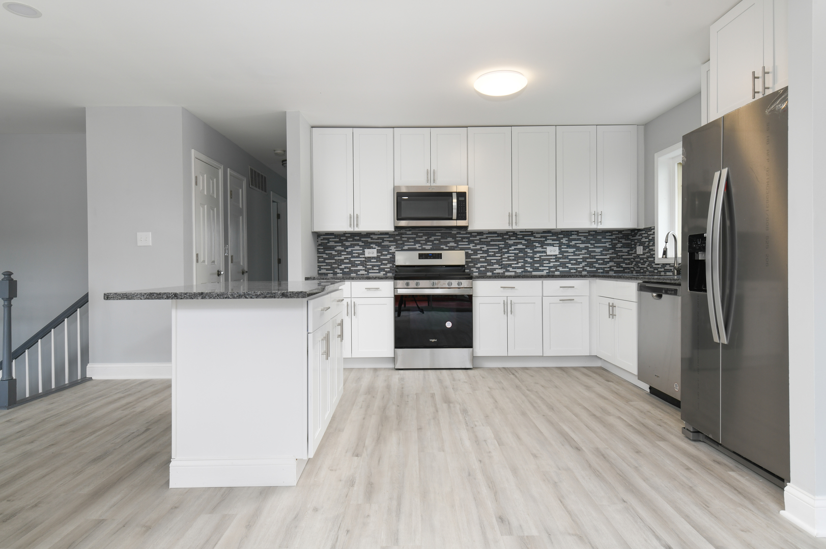 44 Redwood Trail Wheeling, IL 60090 - Photo 6 of 18 a kitchen with a refrigerator sink and cabinets