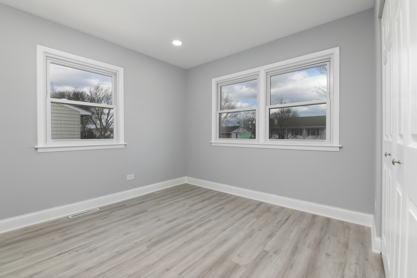 44 Redwood Trail Wheeling, IL 60090 - Photo 8 of 18 a view of empty room with wooden floor and fan