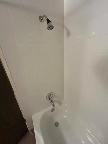 a bathroom with a white bath tub