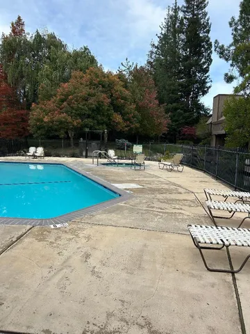 a view of swimming pool with a yard