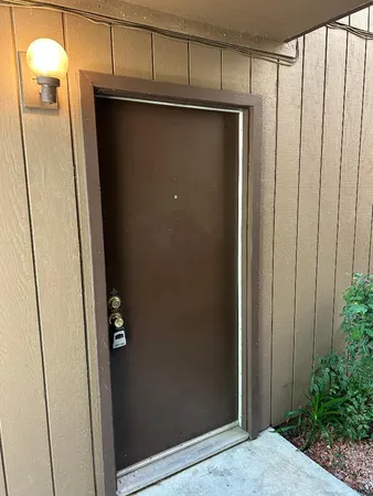 a view of a refrigerator in kitchen and wooden floor