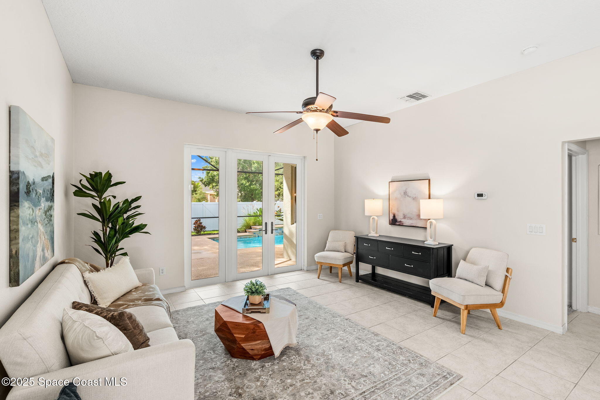 1908 Tullagee Avenue Melbourne, FL 32940 - Photo 17 of 58 a living room with furniture and a window