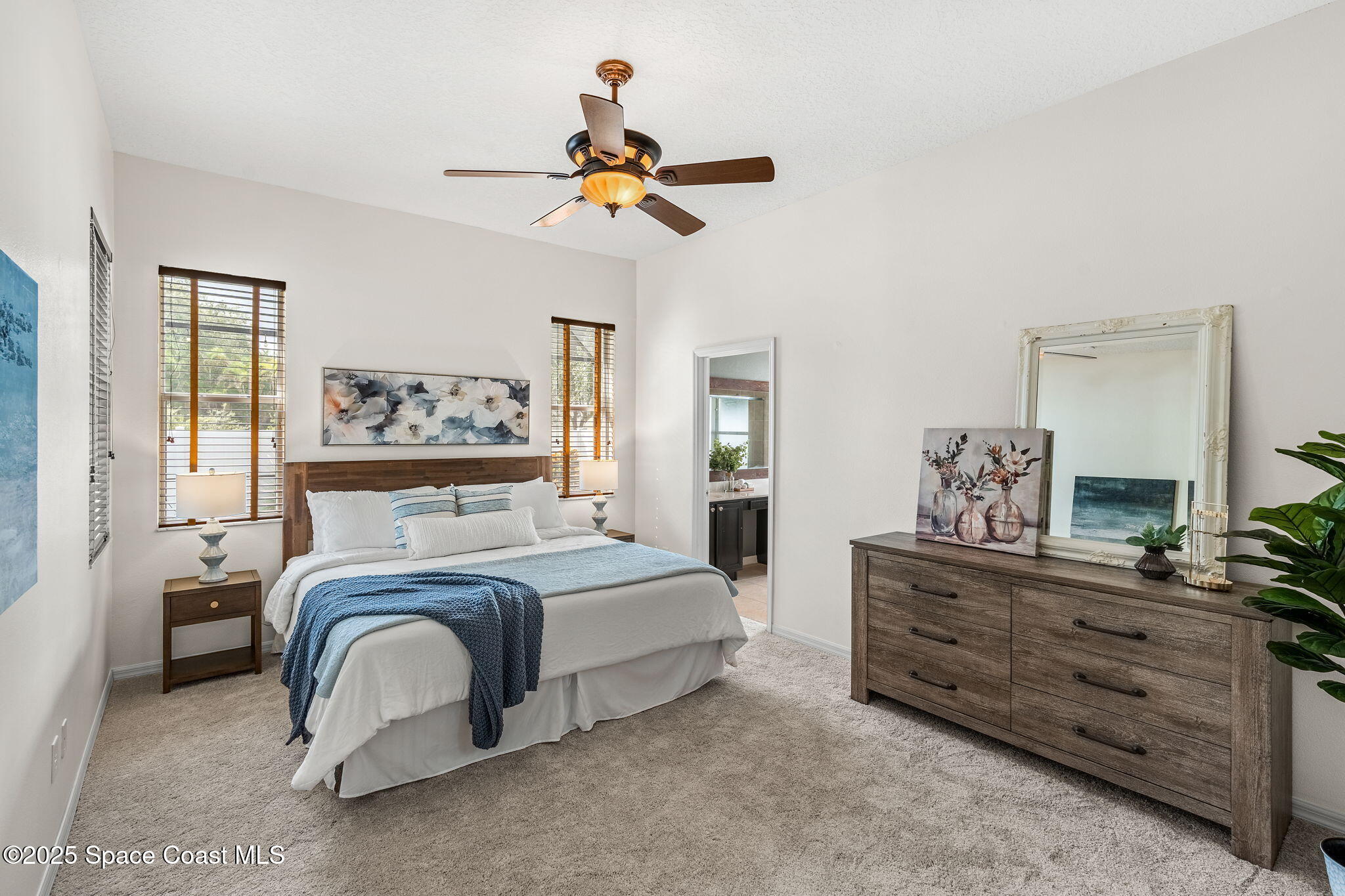 1908 Tullagee Avenue Melbourne, FL 32940 - Photo 21 of 58 a bedroom with a bed and wooden floor