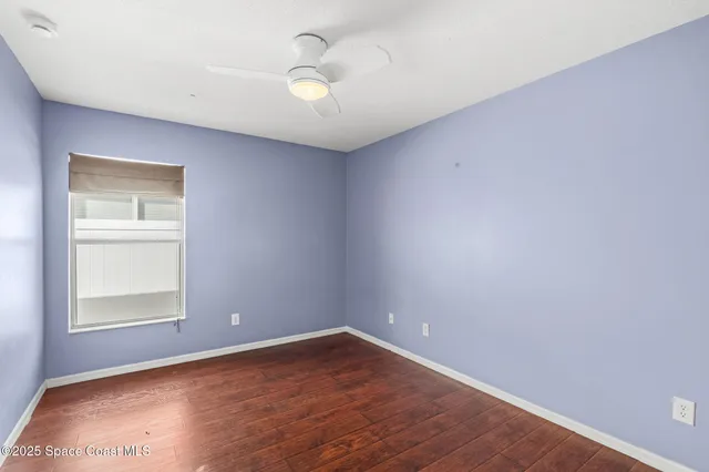 a view of chairs and table in the patio