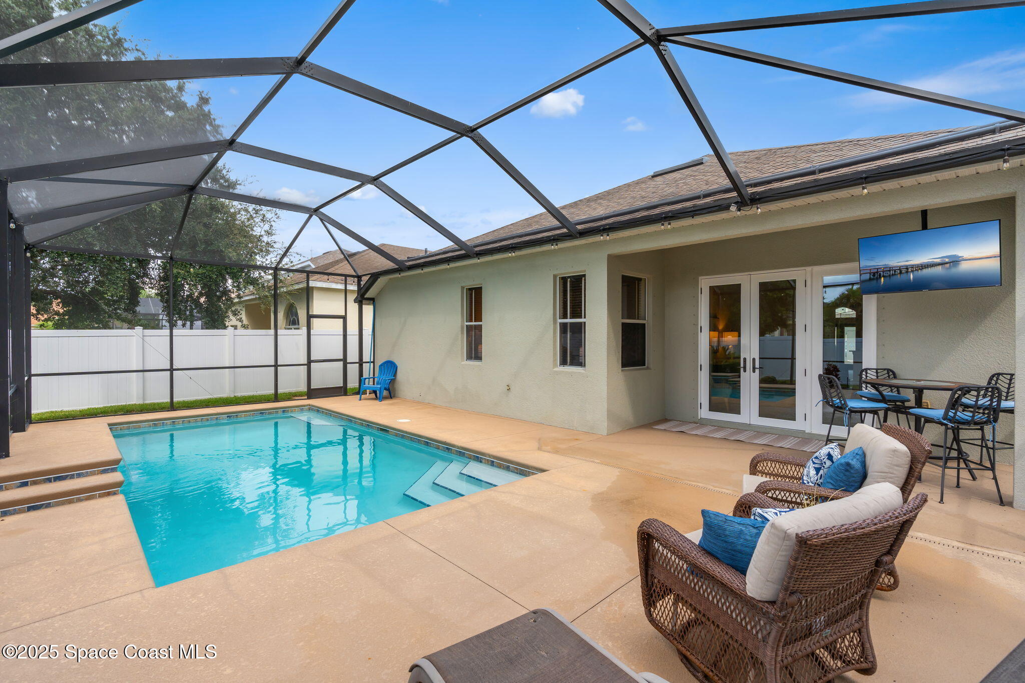 1908 Tullagee Avenue Melbourne, FL 32940 - Photo 35 of 58 a view of a patio with swimming pool table and chairs