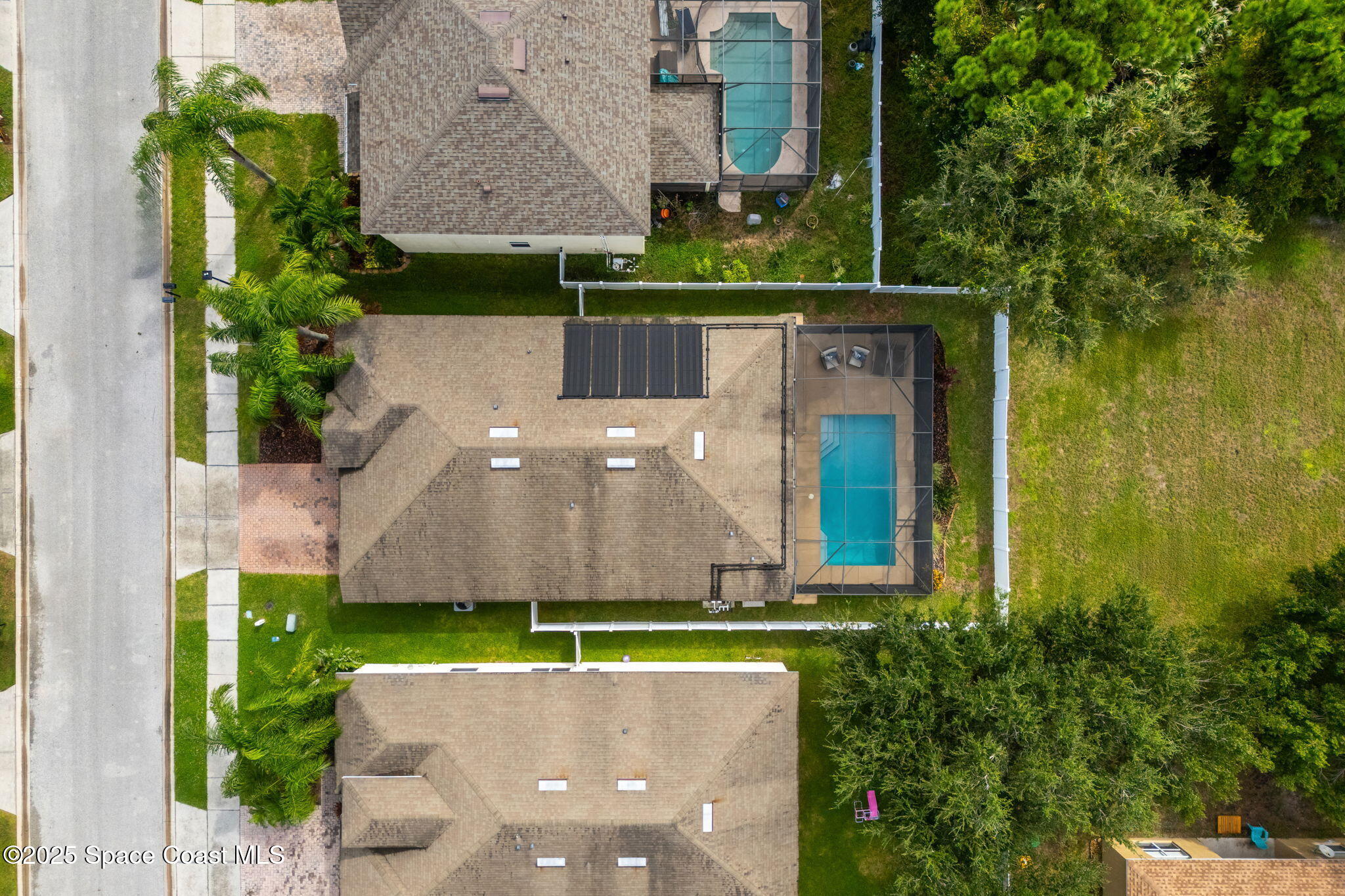 1908 Tullagee Avenue Melbourne, FL 32940 - Photo 41 of 58 an aerial view of a house with a garden and a yard