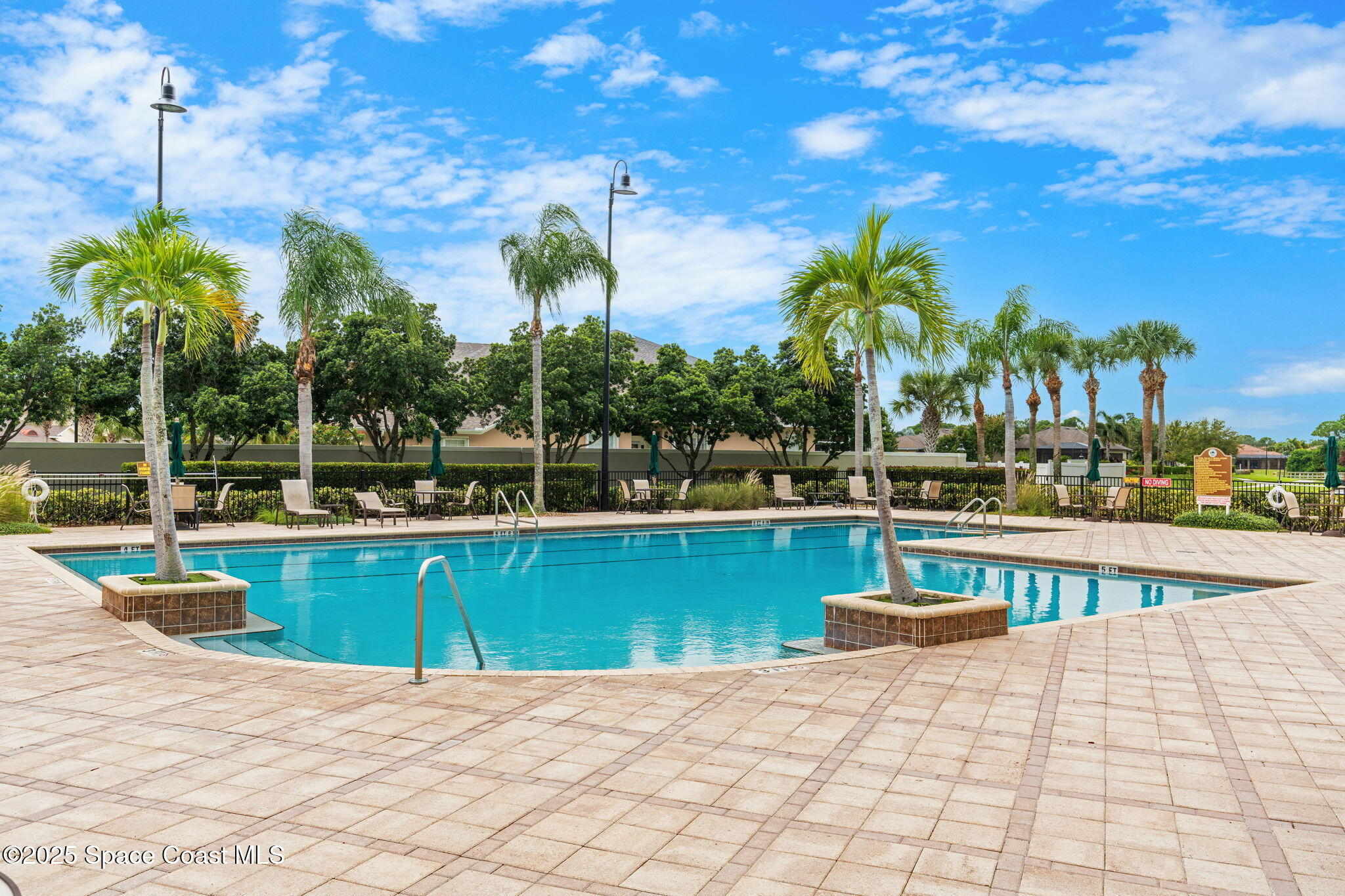 1908 Tullagee Avenue Melbourne, FL 32940 - Photo 50 of 58 a view of a swimming pool with a lounge chairs