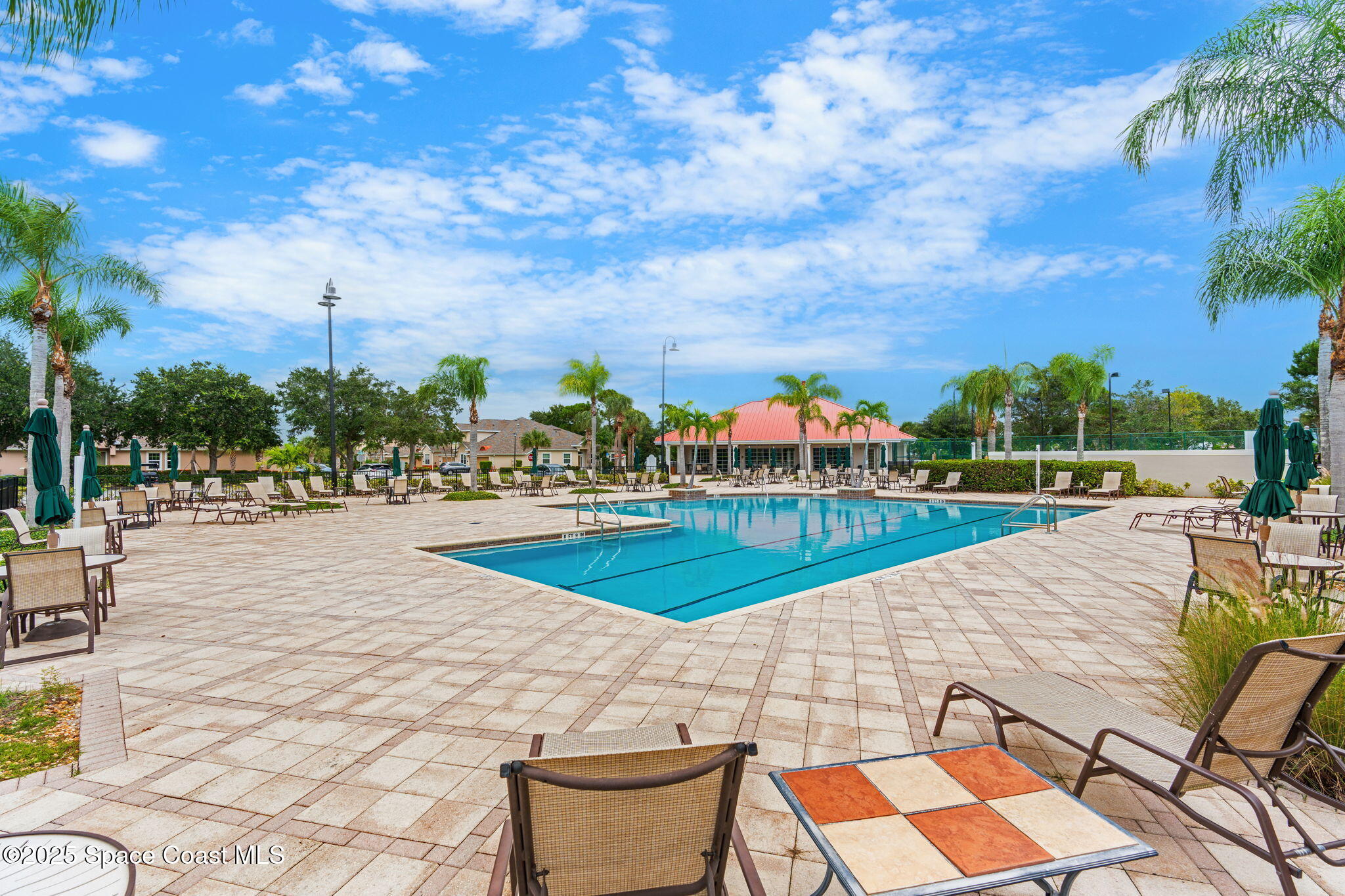 1908 Tullagee Avenue Melbourne, FL 32940 - Photo 51 of 58 a view of a swimming pool with an outdoor seating