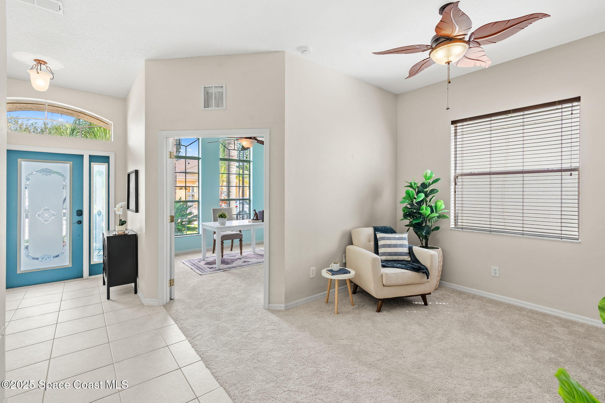 1908 Tullagee Avenue Melbourne, FL 32940 - Photo 7 of 58 a living room with furniture and a window