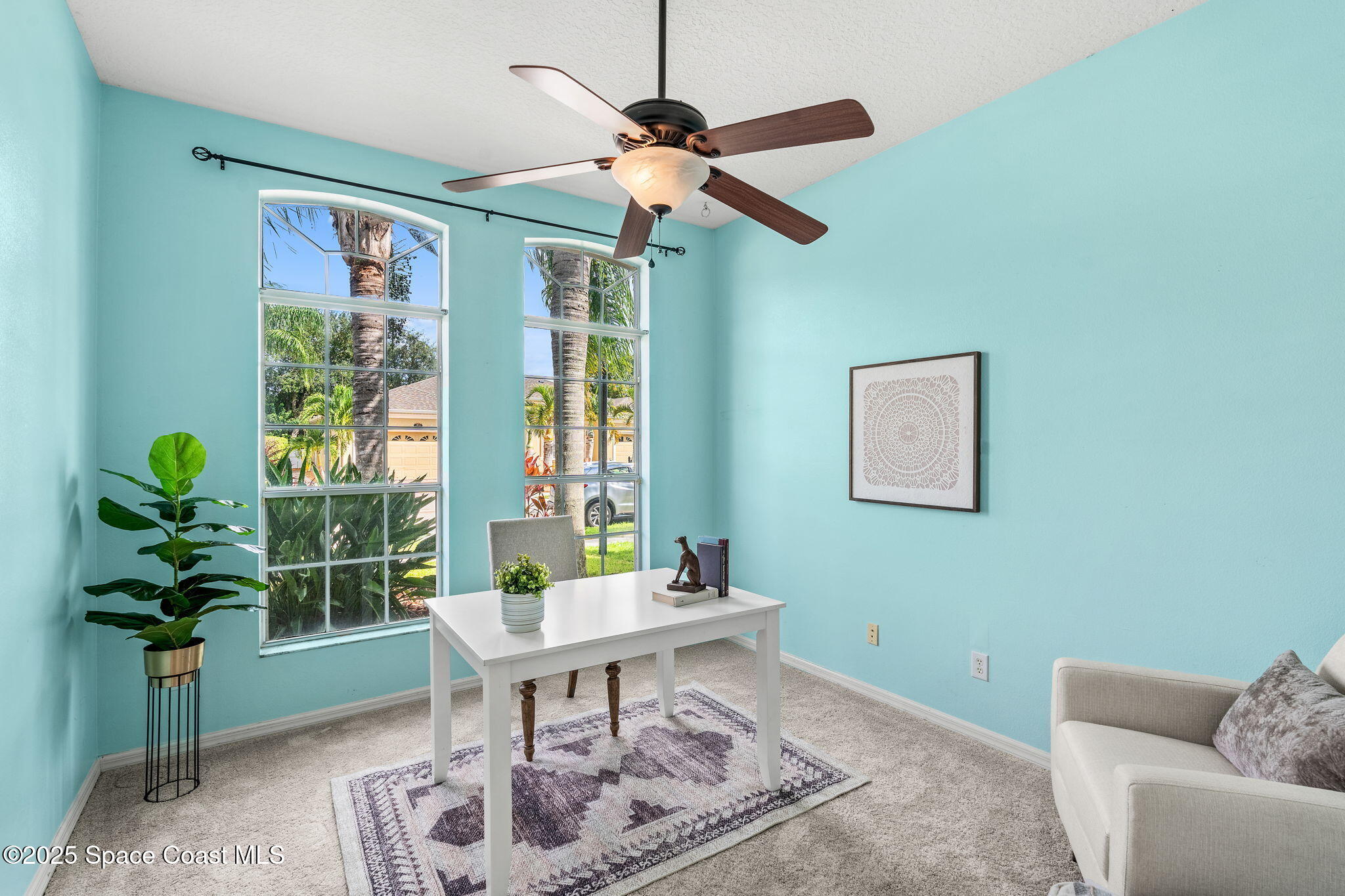 1908 Tullagee Avenue Melbourne, FL 32940 - Photo 8 of 58 a work room with furniture and a potted plant