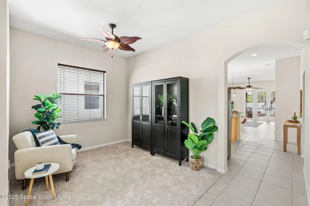 a kitchen with stainless steel appliances granite countertop a refrigerator a stove and a sink with wooden floor