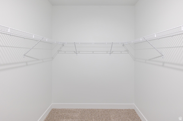 4661 Poplar Way, Unit R302 Mapleton, UT 84664 - Photo 9 of 17 Walk in closet with light colored carpet