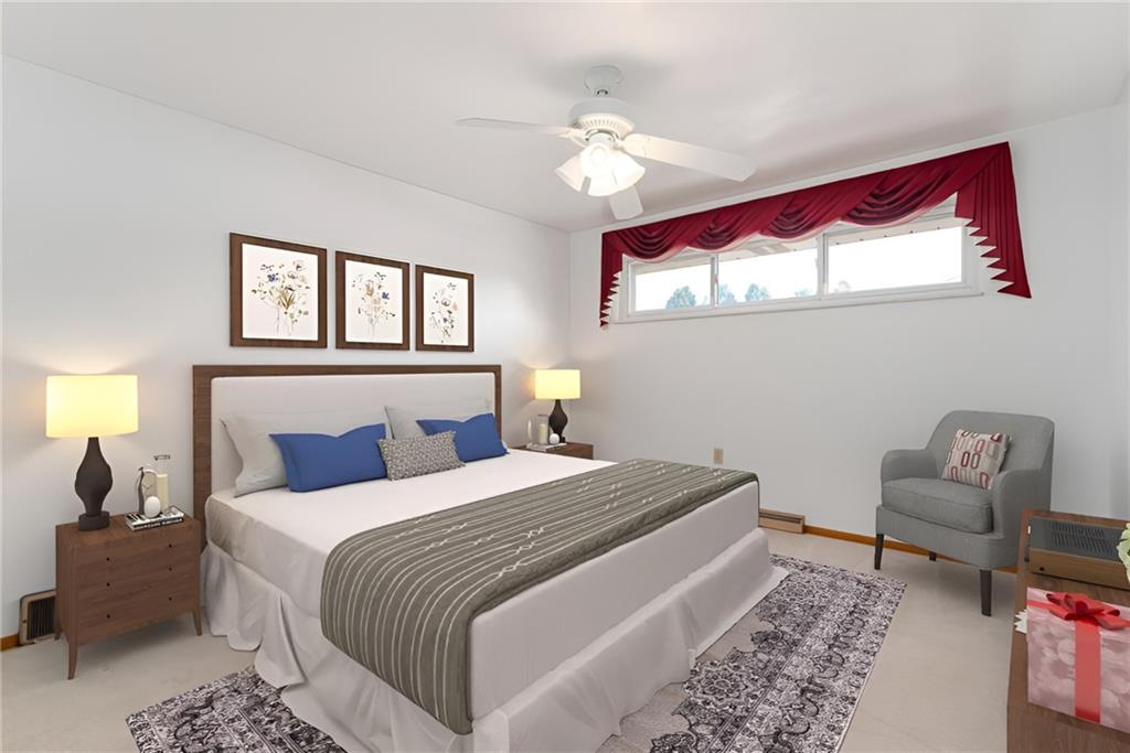 247 Winfield Road Sarver, PA 16055 - Photo 18 of 24 a bedroom with a bed and a chandelier