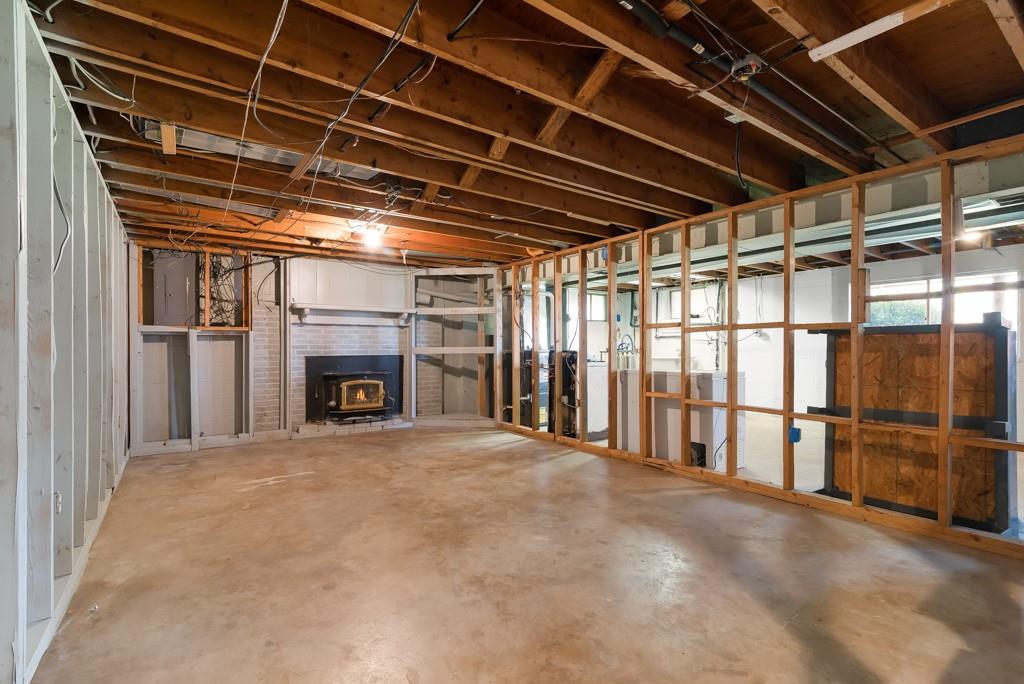 247 Winfield Road Sarver, PA 16055 - Photo 20 of 24 a view of an empty room with a fireplace and window