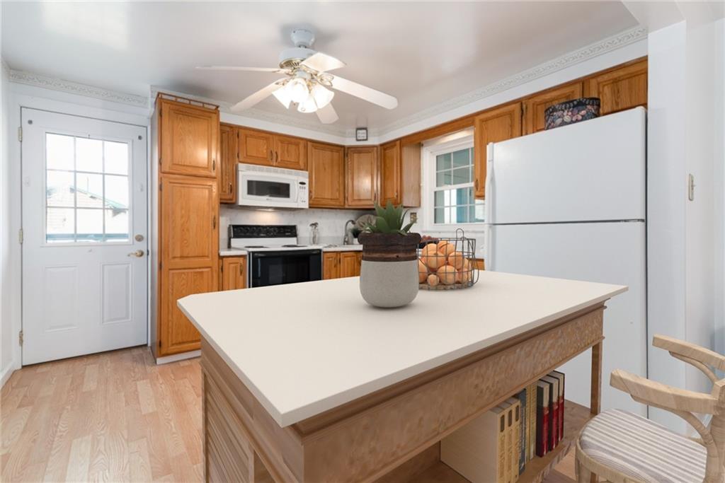247 Winfield Road Sarver, PA 16055 - Photo 8 of 24 a kitchen with a stove a refrigerator and a refrigerator