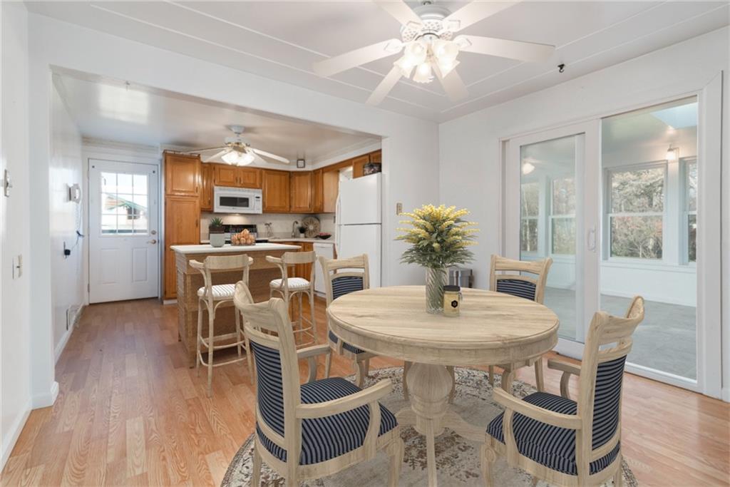 247 Winfield Road Sarver, PA 16055 - Photo 10 of 24 a dining room with furniture a chandelier and wooden floor