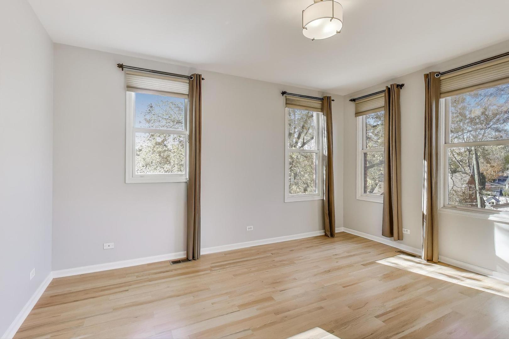 125 North Rose Street, Unit E Palatine, IL 60067 - Photo 13 of 28 an empty room with windows and closet