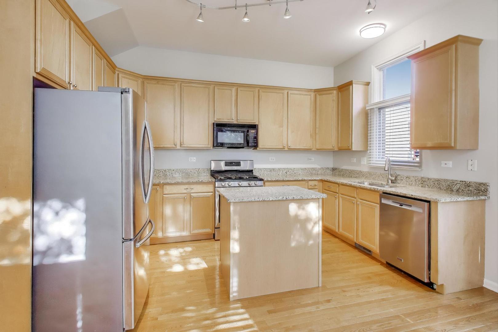 125 North Rose Street, Unit E Palatine, IL 60067 - Photo 7 of 28 a kitchen with stainless steel appliances granite countertop a stove a sink and a refrigerator