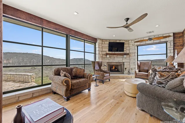 a large white kitchen with a large window