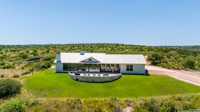 a view of a chairs and table in patio