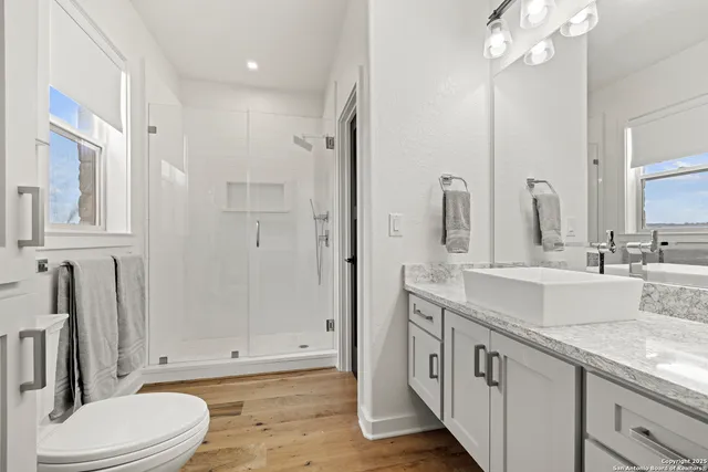 a view of a terrace with a bench and some trees