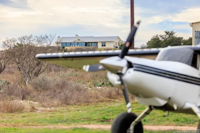 a living room with furniture fireplace and a flat screen tv