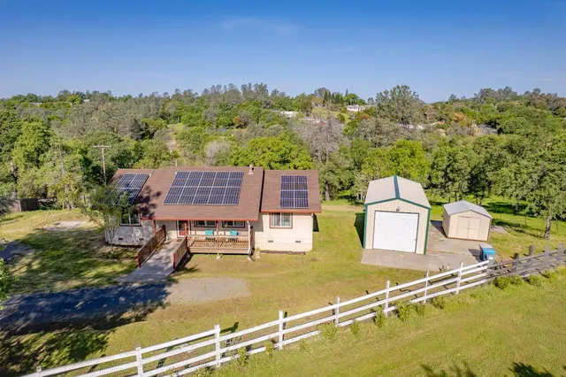 an aerial view of residential houses with swimming pool