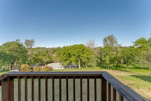 a view of a balcony with an outdoor space and seating