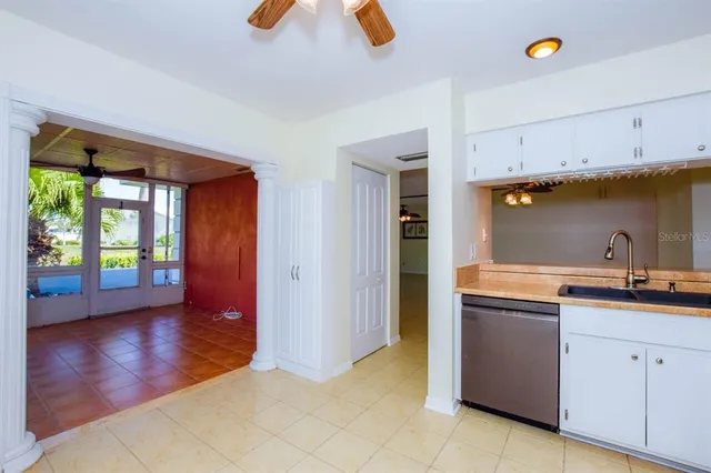 a kitchen with wooden cabinets and sink