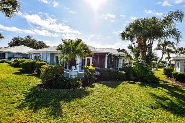 an aerial view of a house with swimming pool