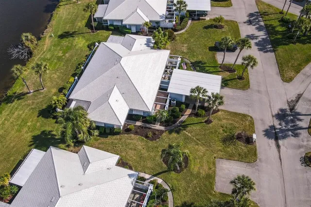 an aerial view of a house with a swimming pool