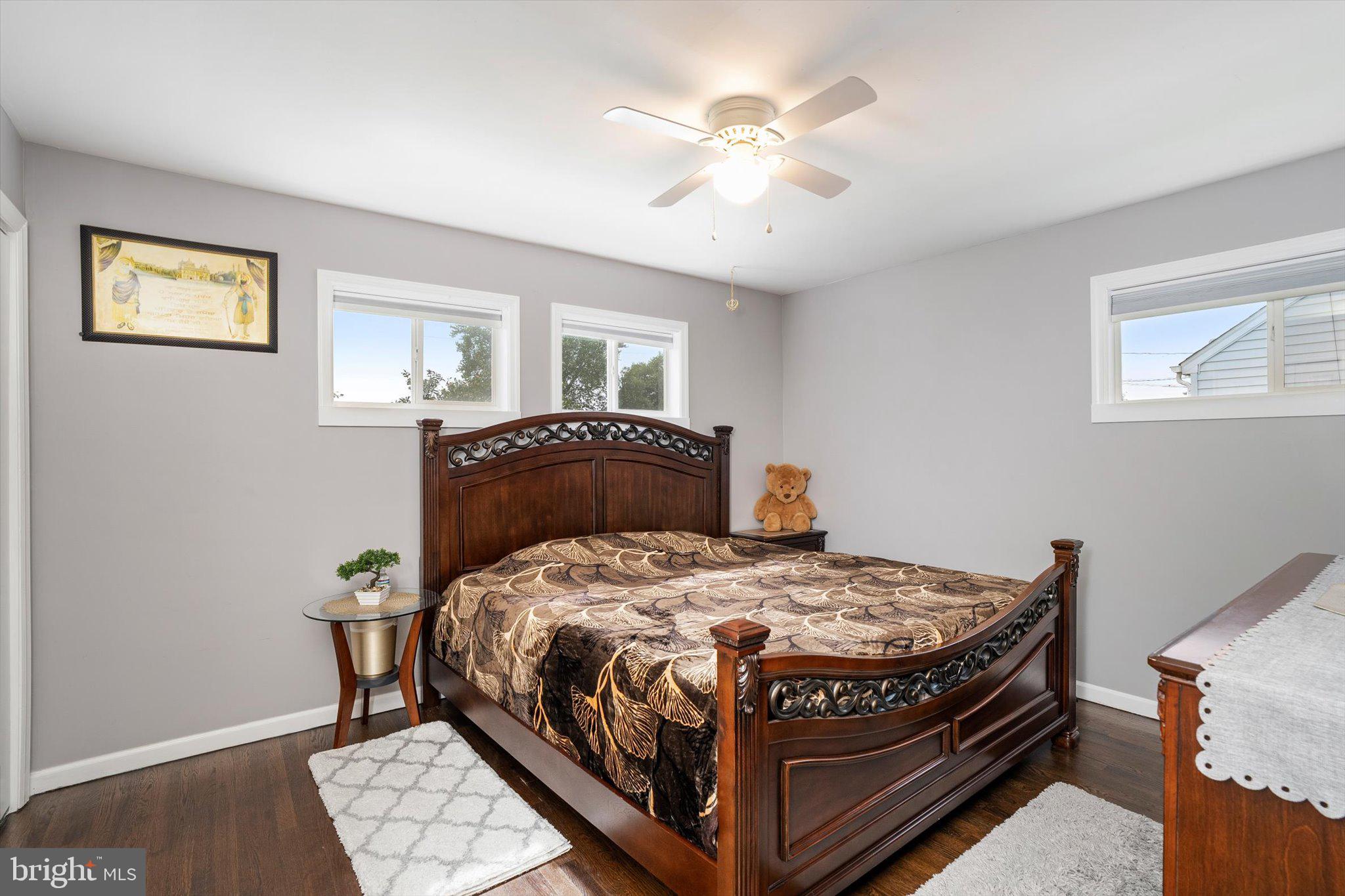 617 Smith Lane Mount Holly, NJ 08060 - Photo 11 of 29 a bedroom with a bed and a chandelier