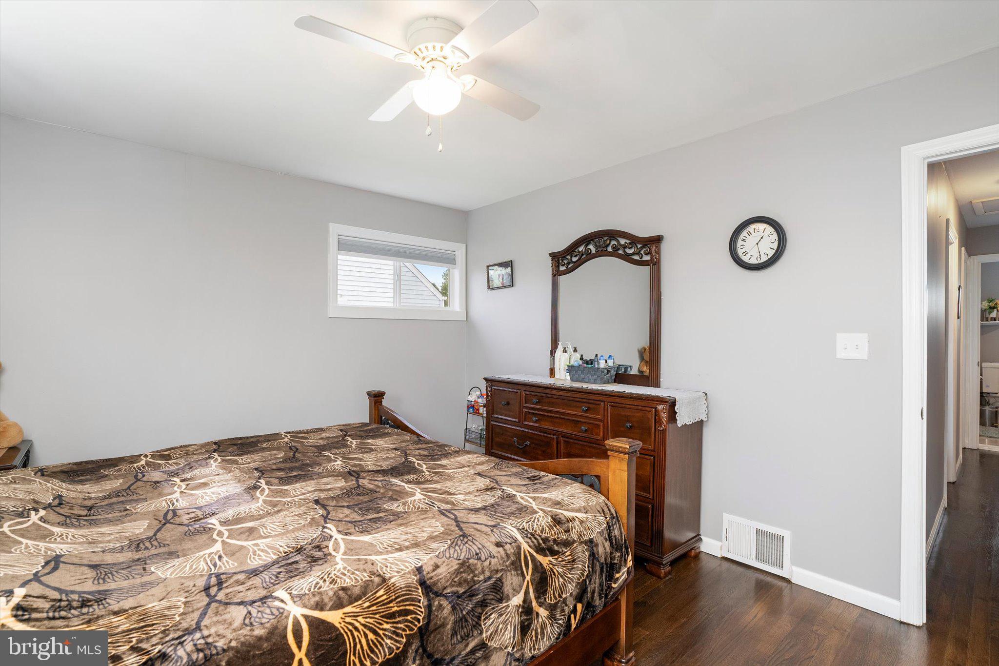 617 Smith Lane Mount Holly, NJ 08060 - Photo 12 of 29 a bedroom with a bed and wooden floor