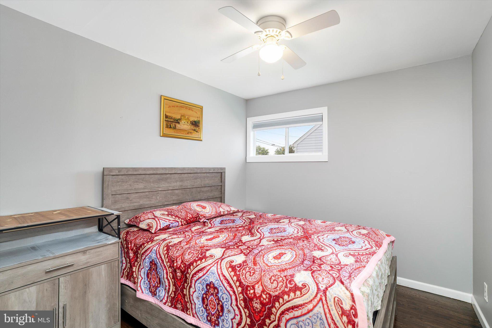 617 Smith Lane Mount Holly, NJ 08060 - Photo 14 of 29 a bedroom with a bed and a chandelier