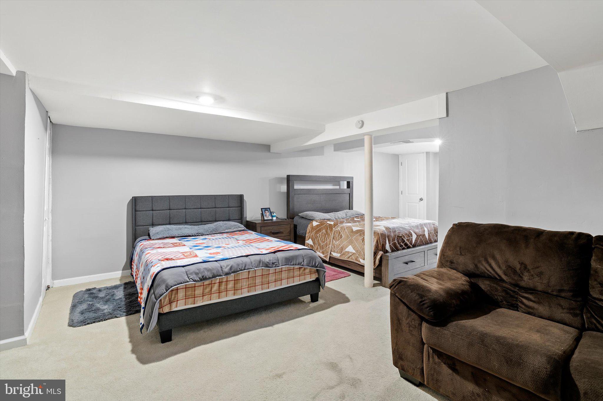 617 Smith Lane Mount Holly, NJ 08060 - Photo 18 of 29 a bedroom with bed couch and window