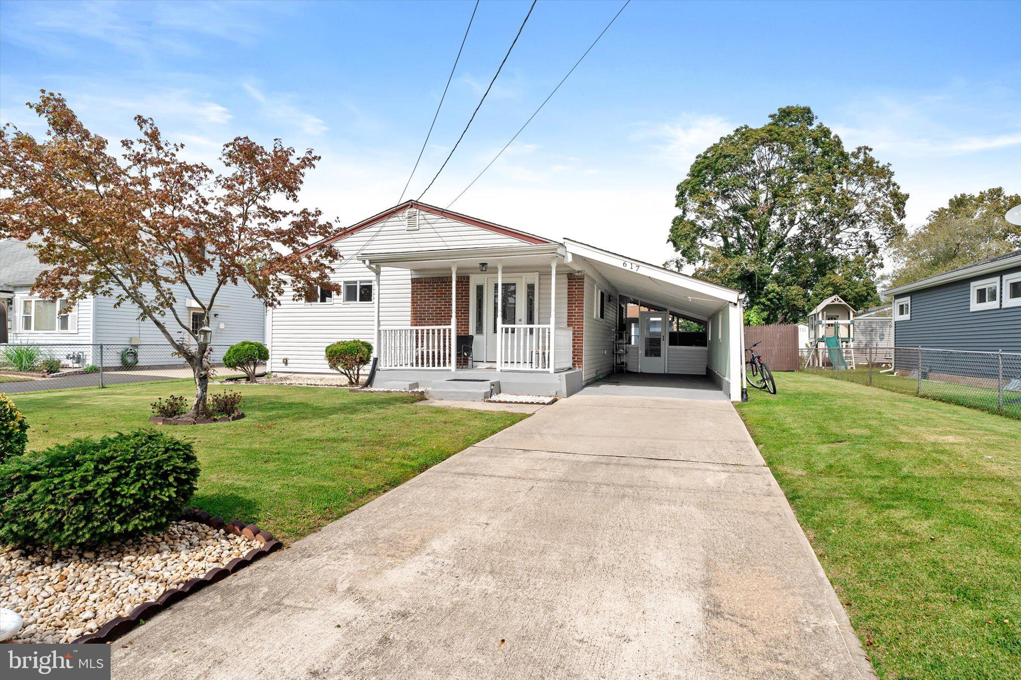 617 Smith Lane Mount Holly, NJ 08060 - Photo 28 of 29 a front view of a house with a garden and trees