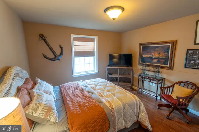 a bedroom with a bed and furniture