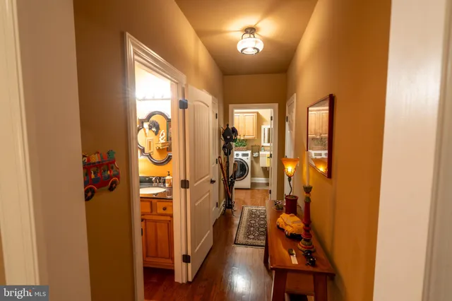a view of an entryway with wooden floor