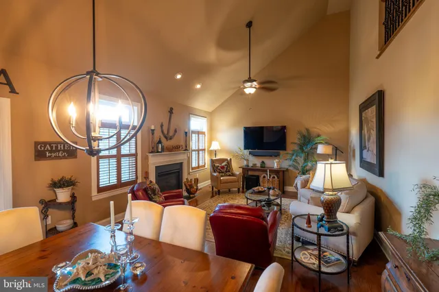 a living room with fireplace furniture and a flat screen tv