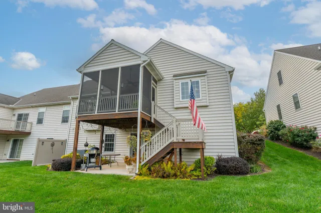 a view of house with backyard