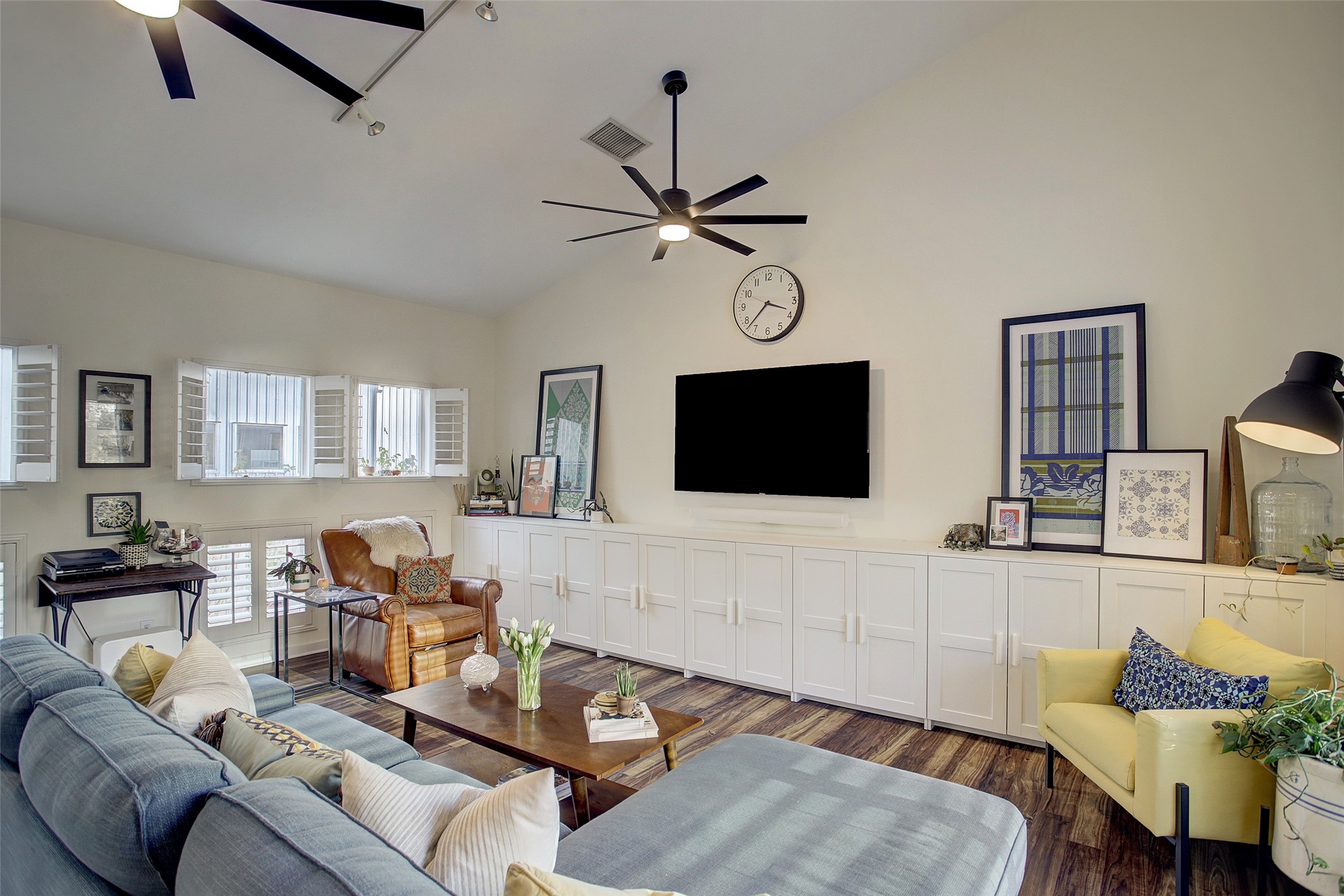 816 Ruthven Street Houston, TX 77019 - Photo 13 of 39 Discover a charming living room with sleek built-in shelves, perfect for stylish storage and display.