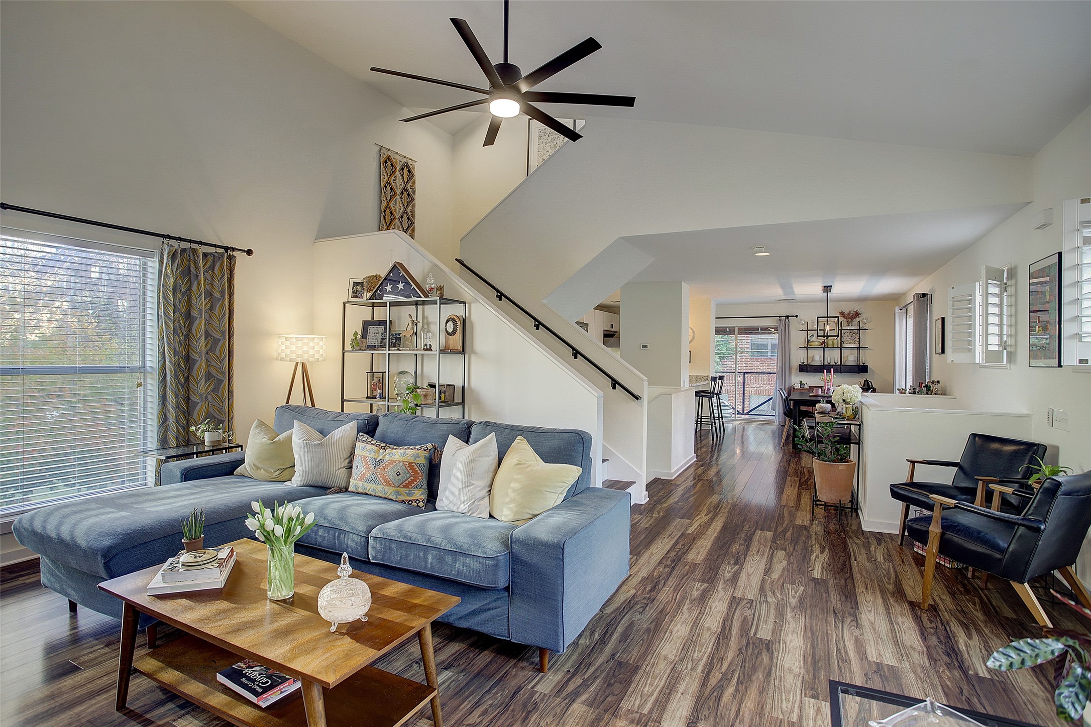 816 Ruthven Street Houston, TX 77019 - Photo 14 of 39 Discover the perfect blend of style and space in this open living and dining area, featuring rich wood floors, modern design, and abundant natural light for an inviting atmosphere.