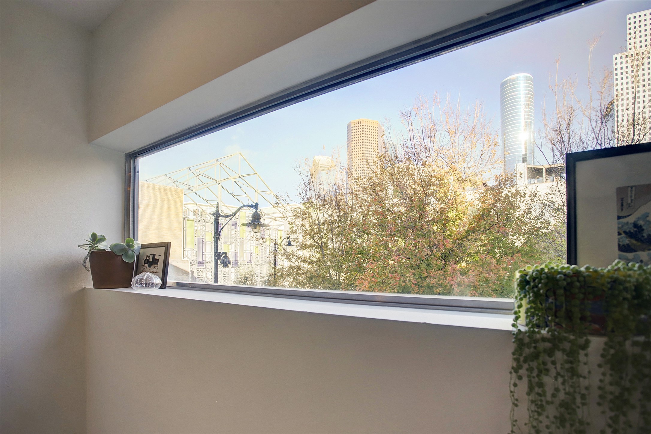 816 Ruthven Street Houston, TX 77019 - Photo 15 of 39 Embrace urban living with this stunning view of downtown Houston, framed perfectly from your cozy home oasis.