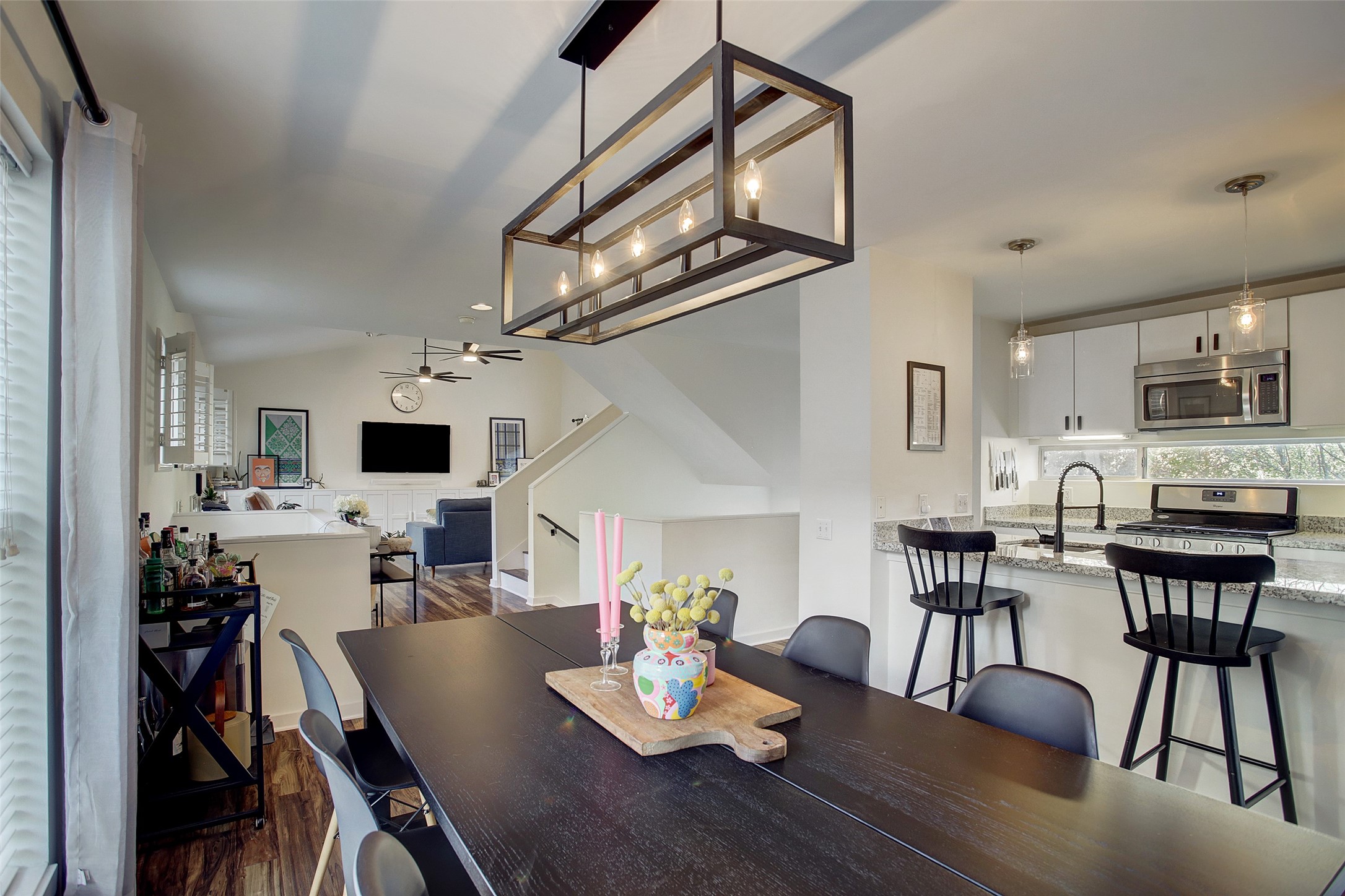 816 Ruthven Street Houston, TX 77019 - Photo 18 of 39 Discover a stylish and inviting dining/kitchen area boasting modern lighting, sleek finishes, and an open layout perfect for hosting and daily living.