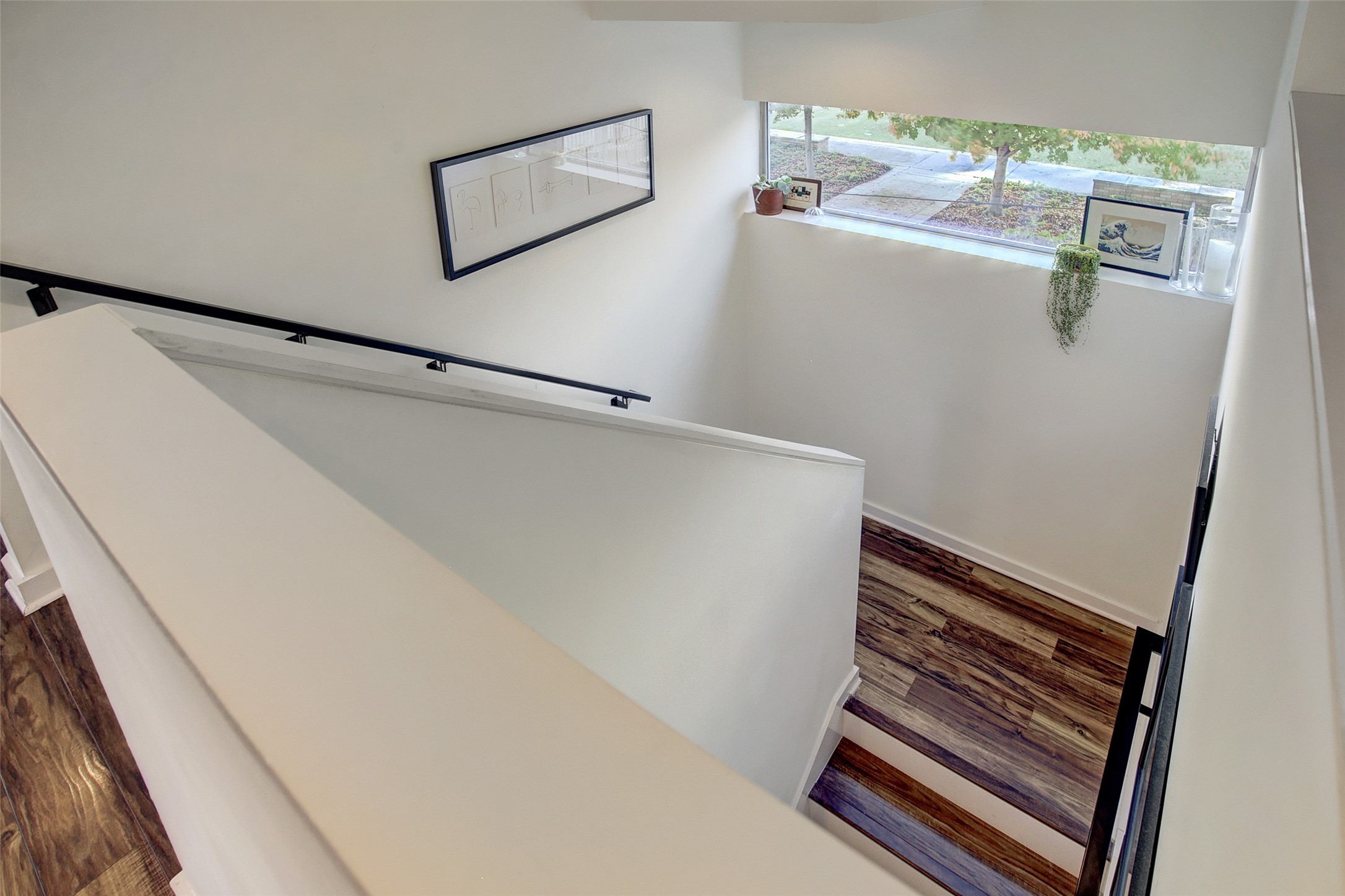 816 Ruthven Street Houston, TX 77019 - Photo 22 of 39 Staircase from 1st to 2nd floor with downtown view.