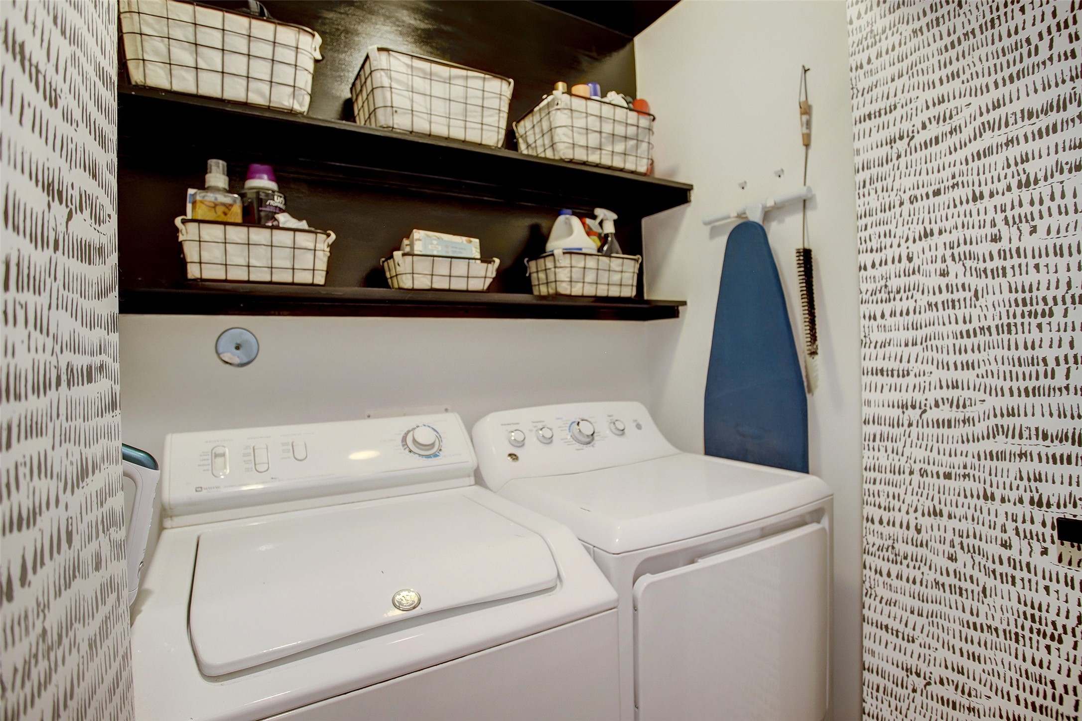816 Ruthven Street Houston, TX 77019 - Photo 7 of 39 Discover the convenience of a stylish first-floor laundry room, perfectly equipped with modern appliances and ample storage to simplify your daily routine.