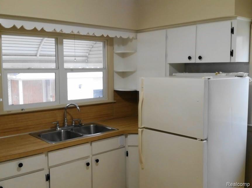 5379 Fenton Road Flint, MI 48507 - Photo 13 of 44 14 Kitchen with Refrigerator.jpg