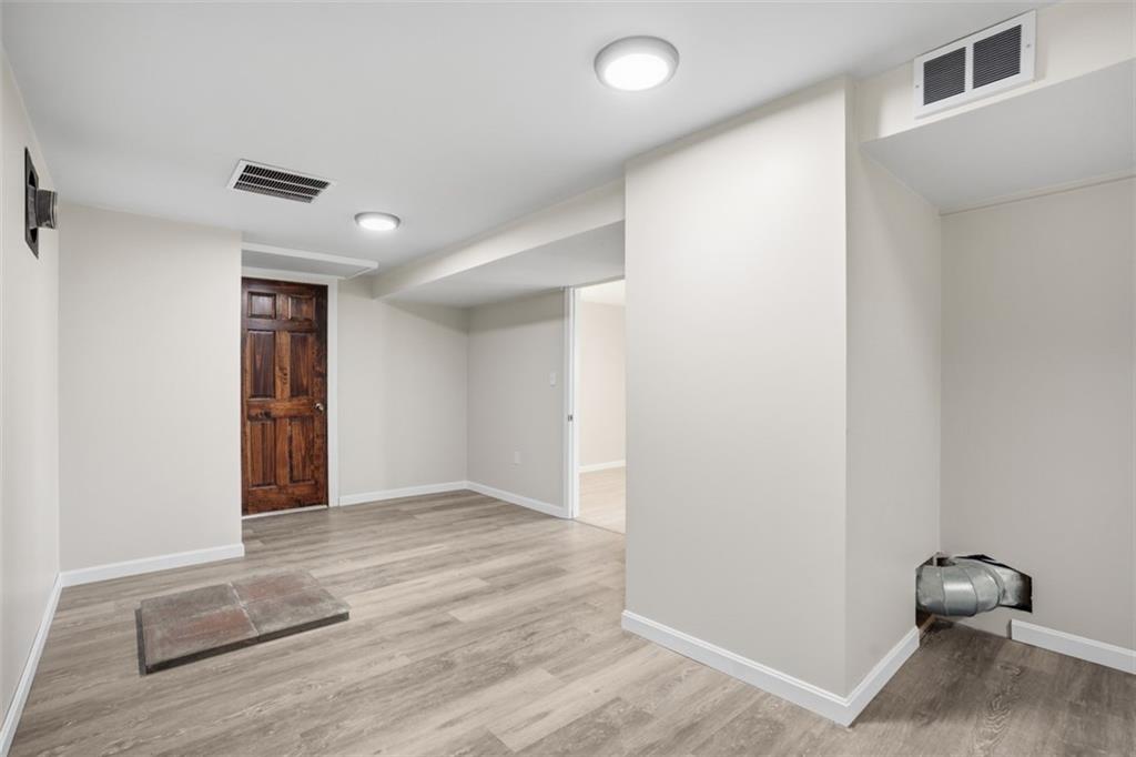 213 Fallen Timber Road Avella, PA 15312 - Photo 11 of 44 This basement has so much space and would be great for entertaining. You can go to the garage and also has the hookup for a fireplace.